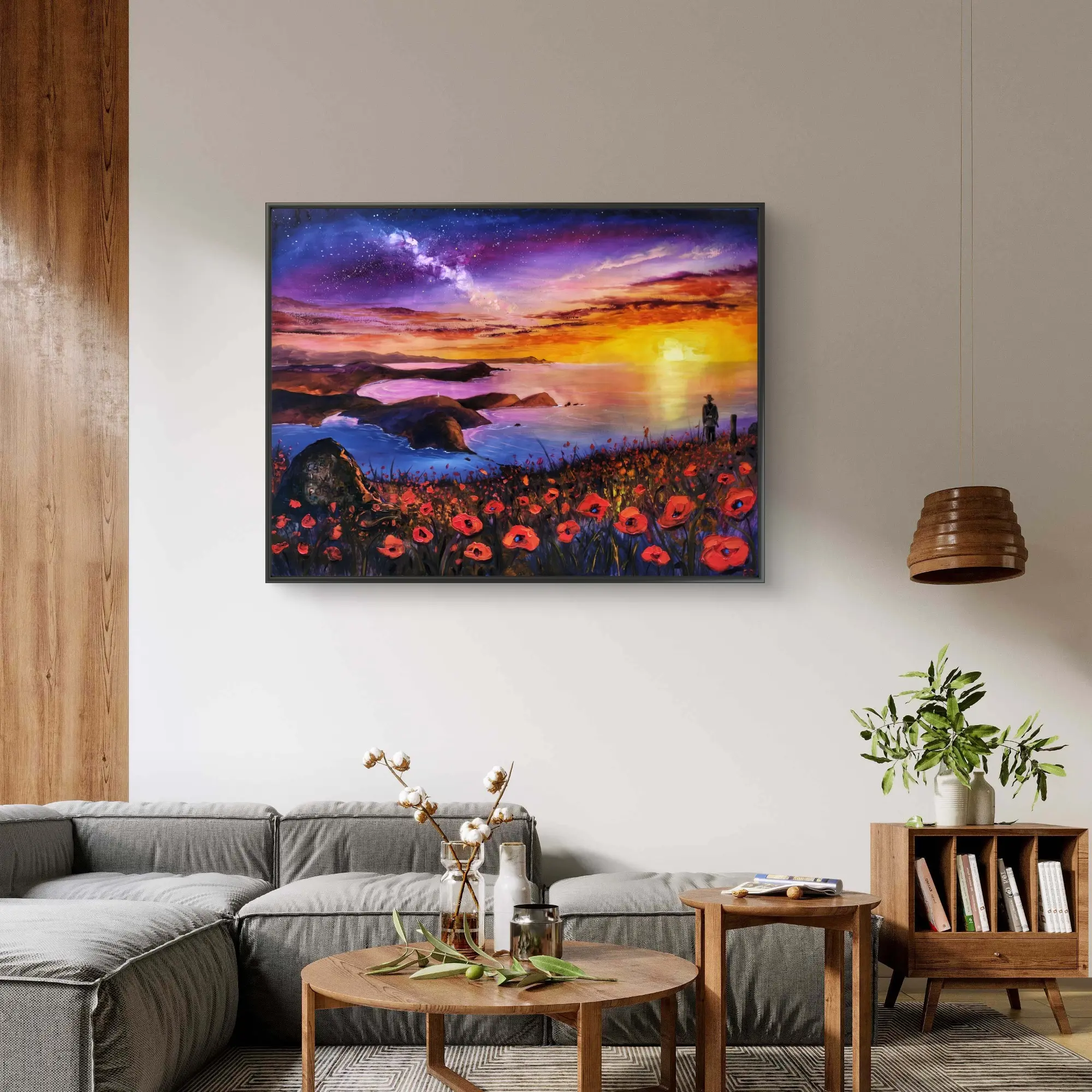 Framed coastal sunset painting above modern sofa