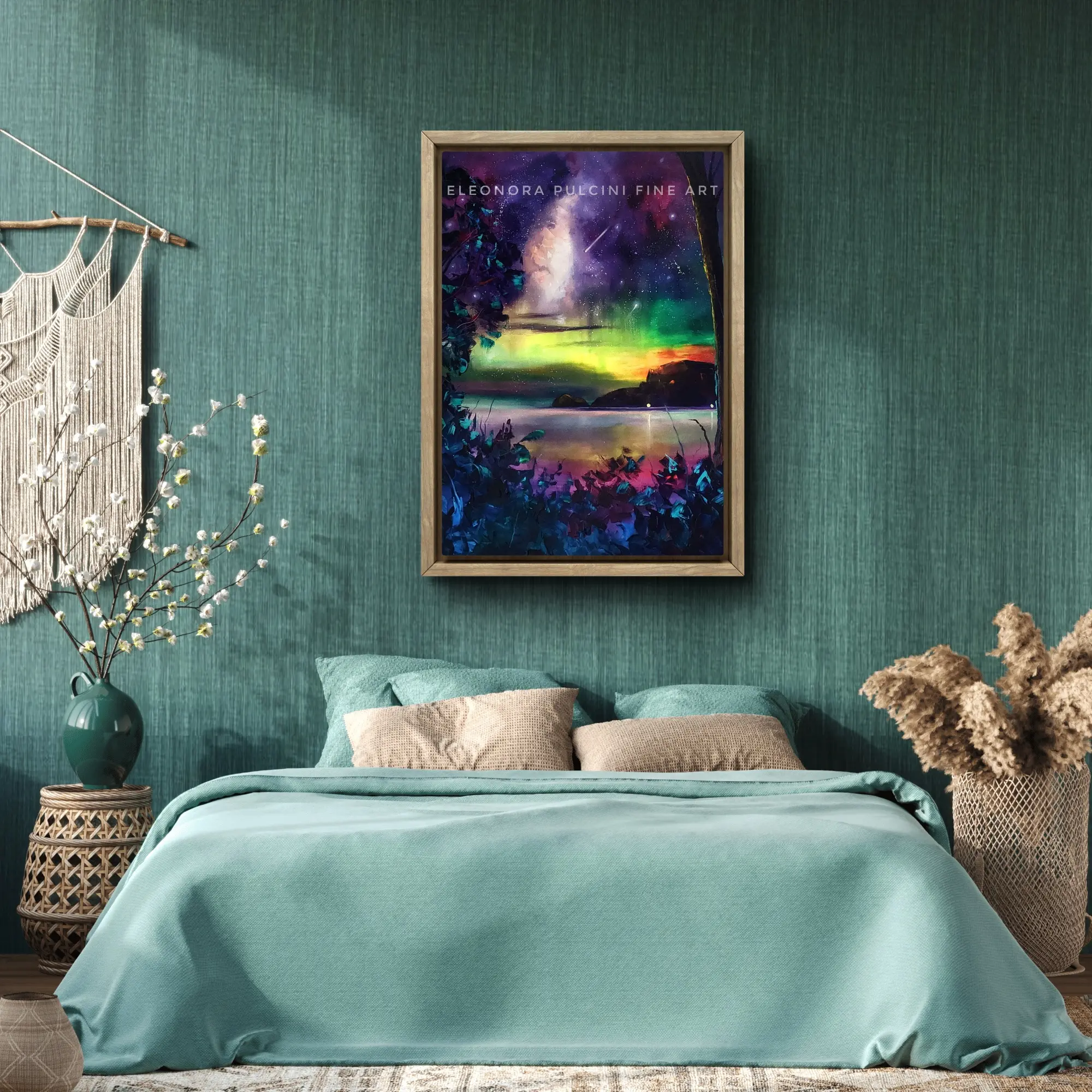 Framed colourful night sky artwork above green bed