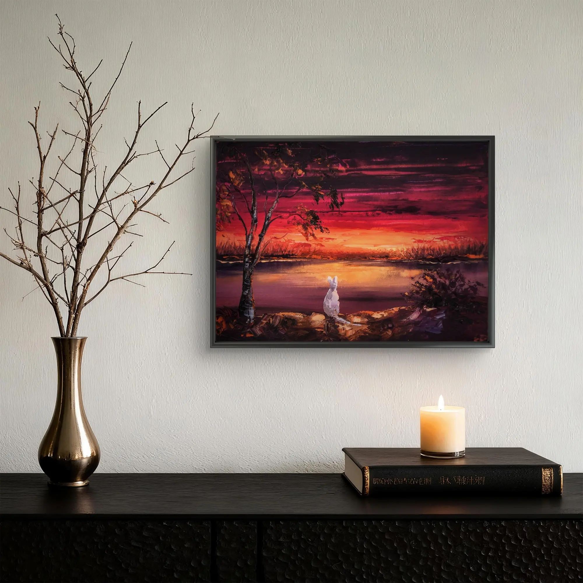 Framed sunset lake painting above console table