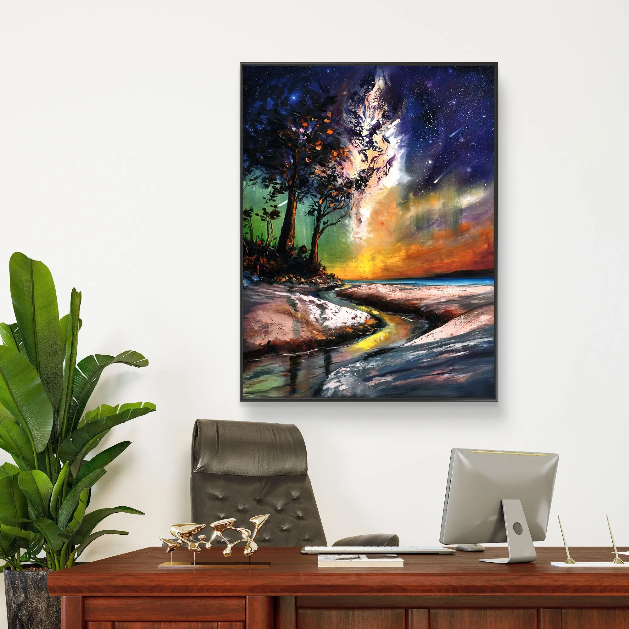 Colourful landscape painting above modern office desk