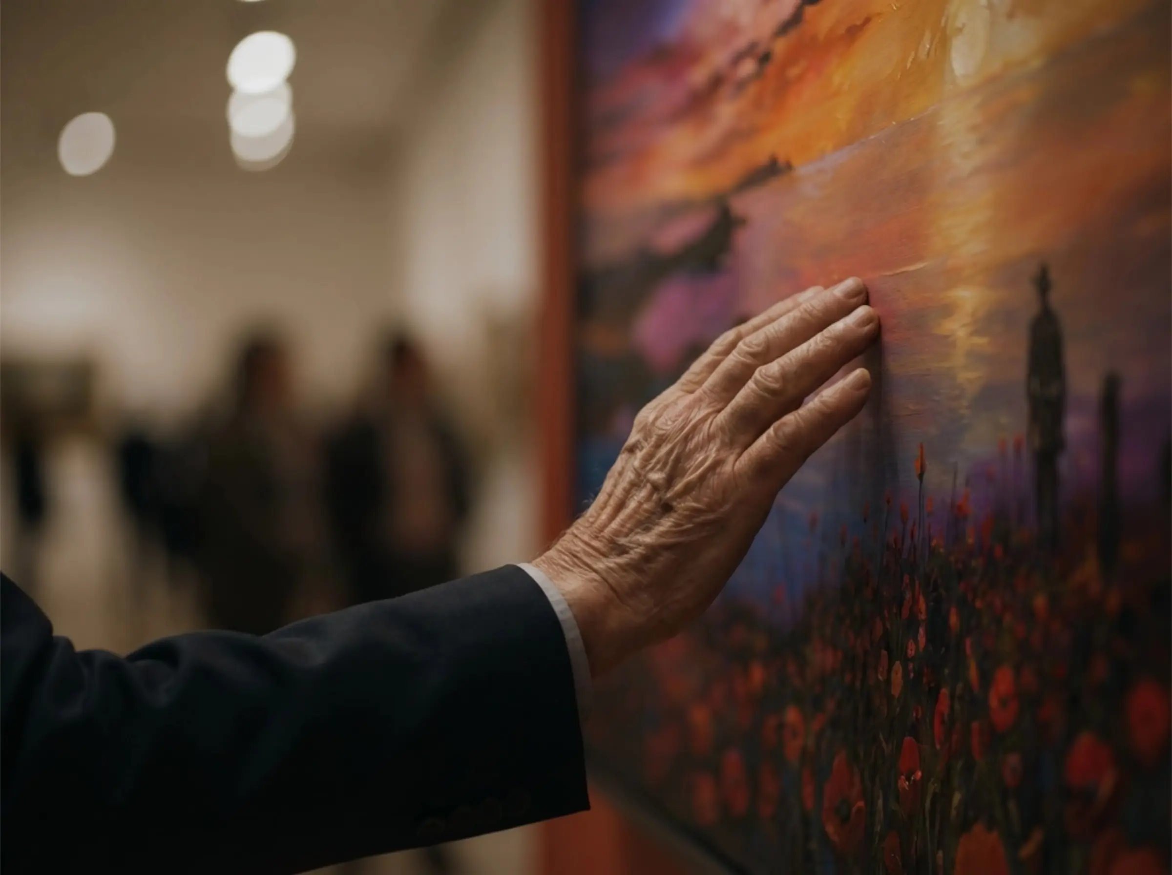 Elderly hand touching painting in art gallery