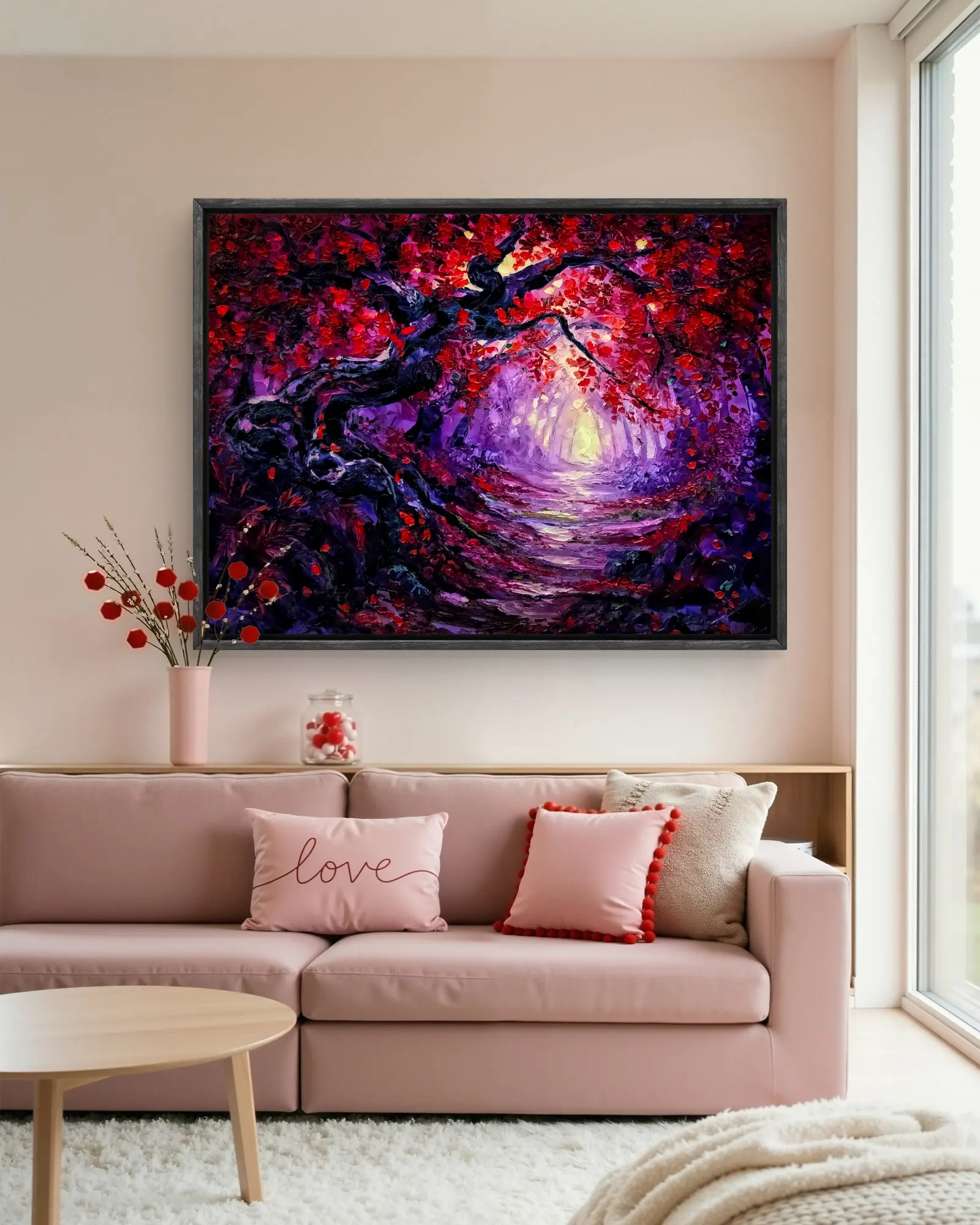 Vibrant forest painting above a blush pink sofa